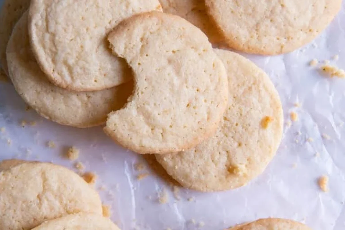Assorted baking soda recipe ideas with pancakes, muffins, biscuits, and kitchen cleaning tools