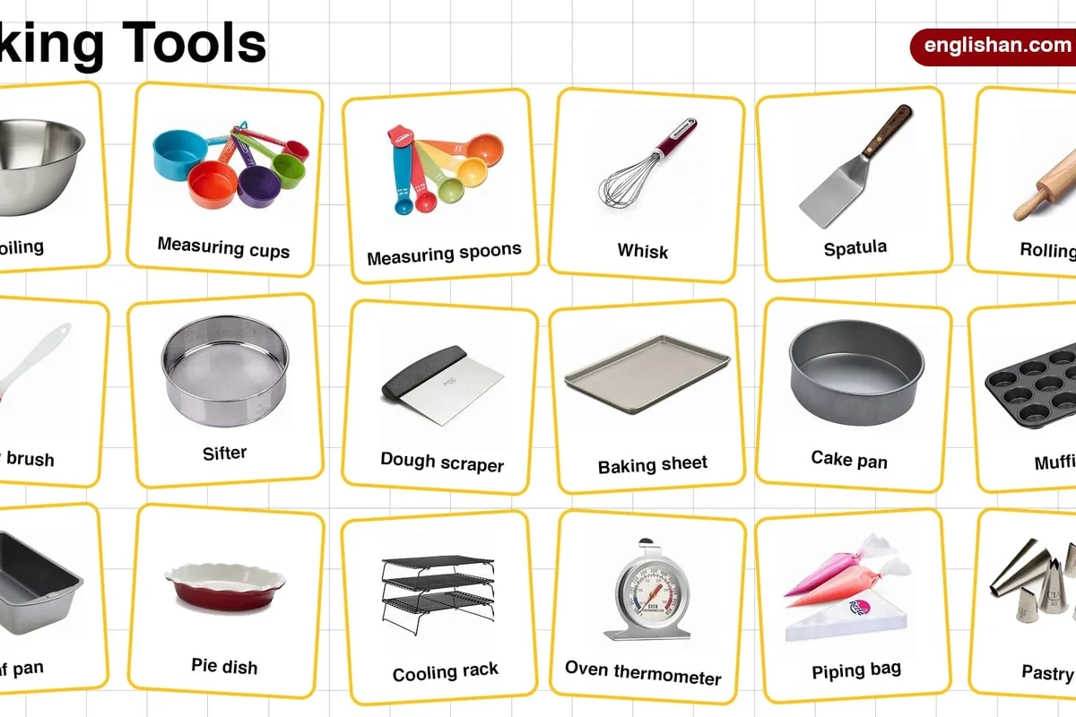 Baking powder and baking soda in small bowls beside measuring spoons on a kitchen counter