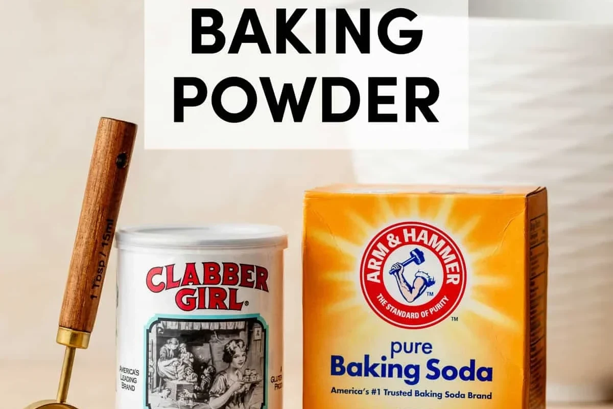 Baking ingredients and measuring spoons for comparing baking powder and baking soda