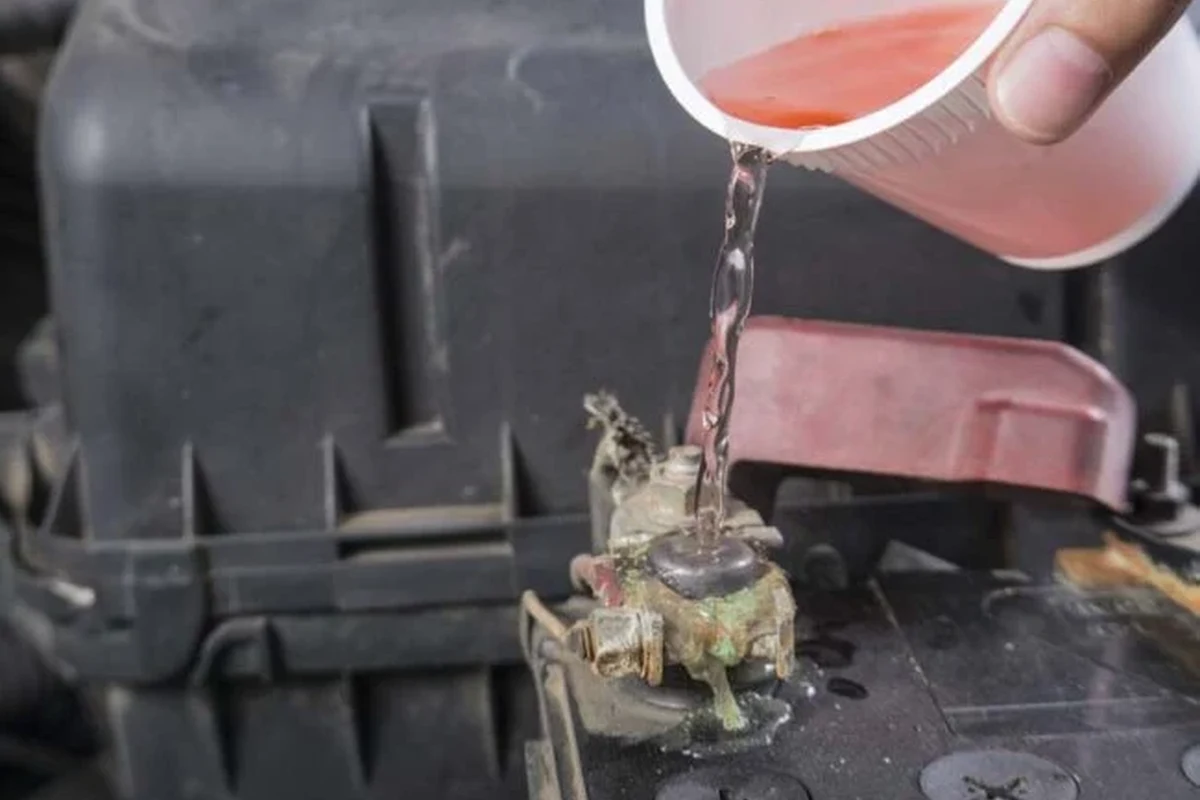Car battery terminals with baking soda cleaning supplies for corrosion removal
