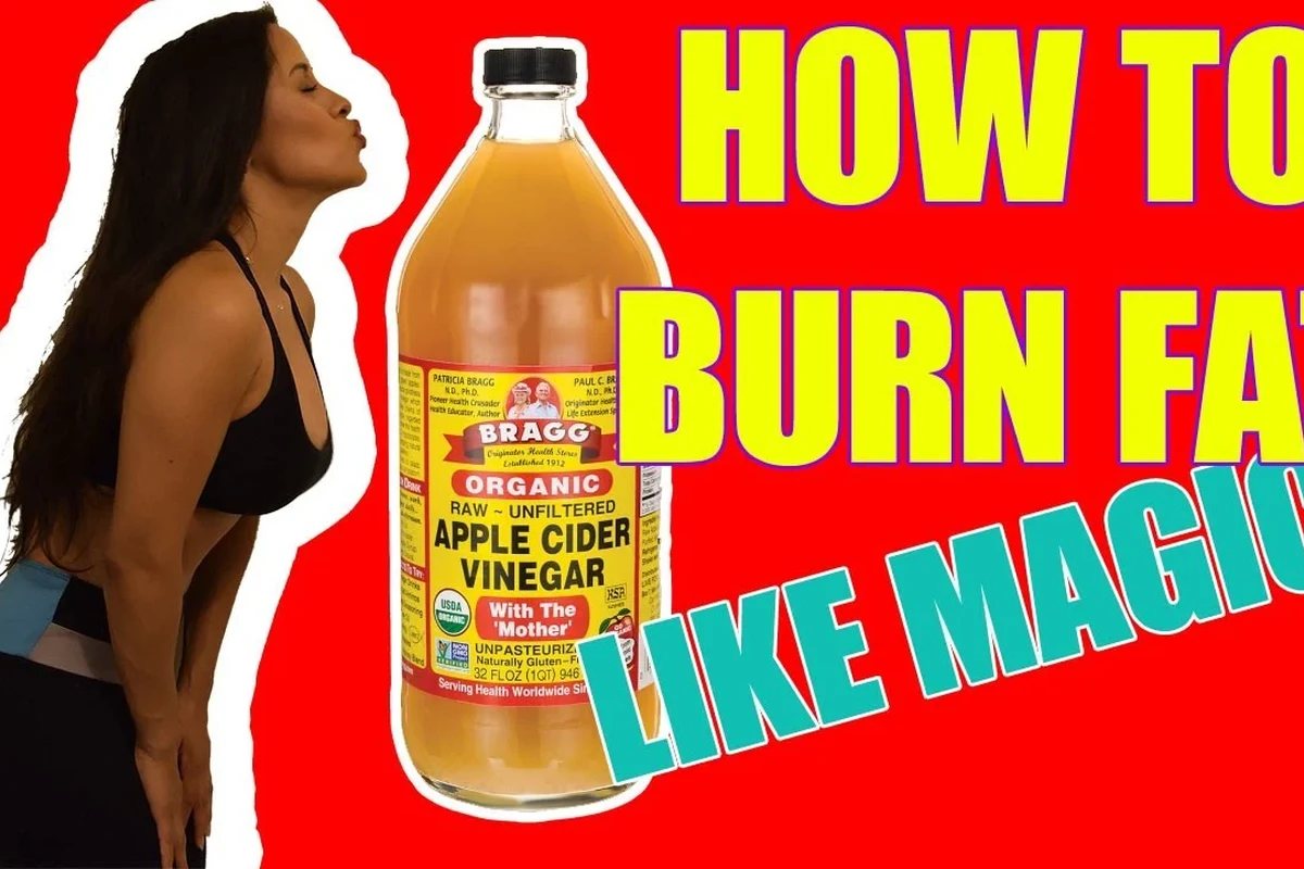 Baking soda and cider vinegar ingredients with a whisk and mixing bowl for baking