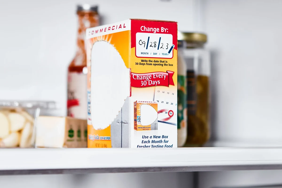 Open box of baking soda inside a refrigerator to absorb food odors