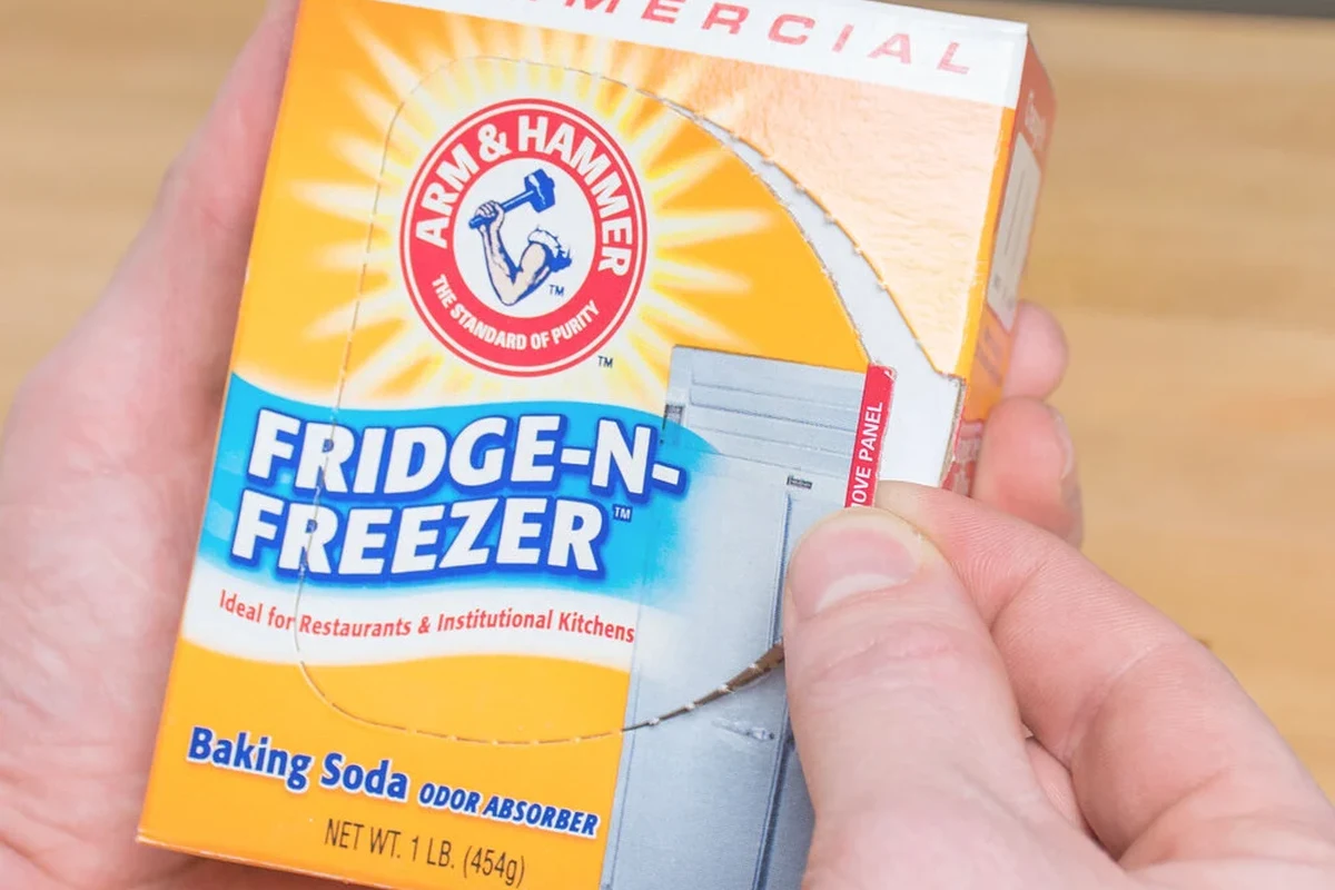Open bowl of baking soda used as a home odor absorber in a kitchen