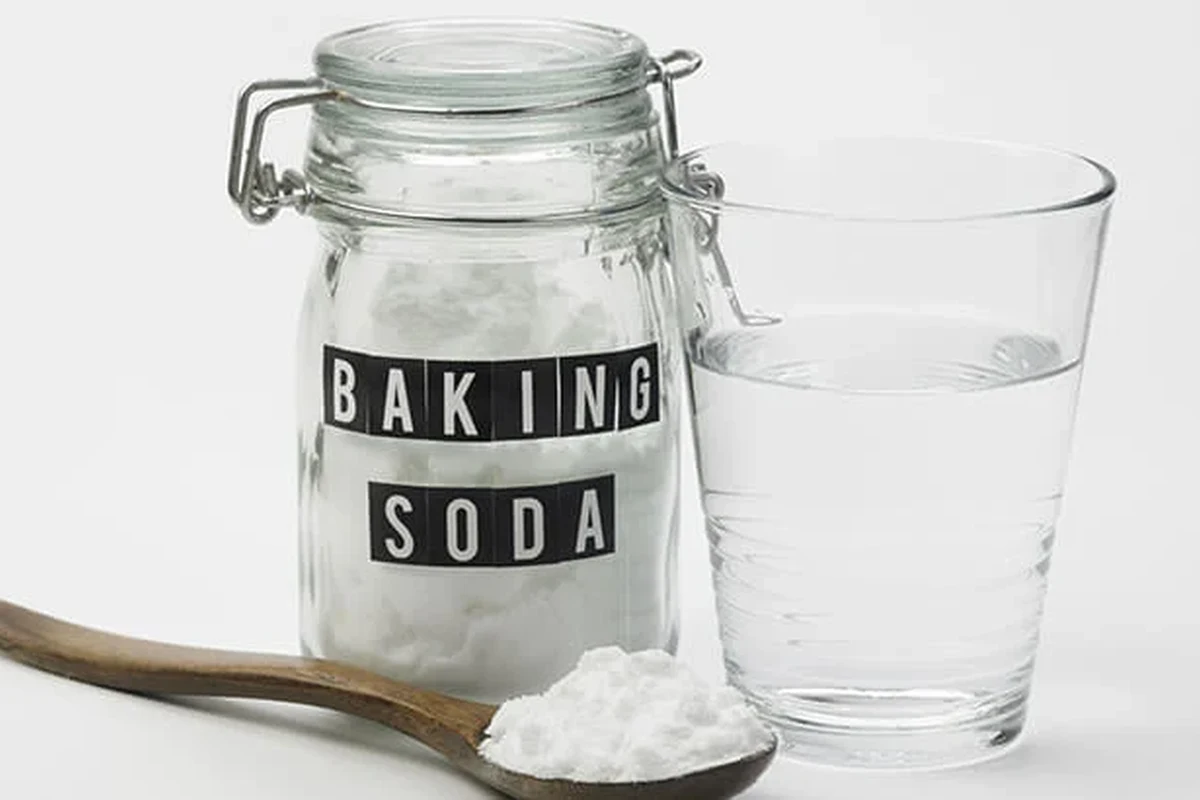 Baking soda paste applied to a small itchy bug bite on skin