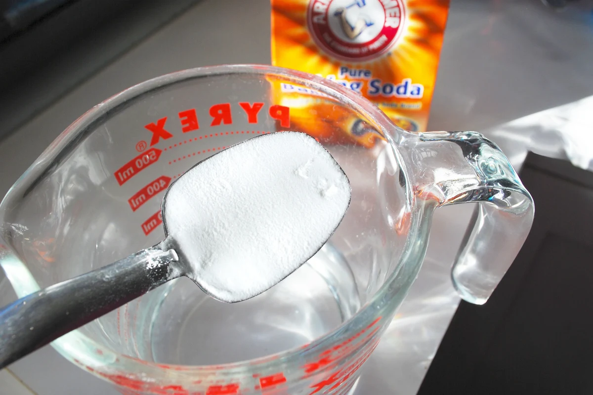 Baking soda in a shallow dish used to remove odor in a kitchen