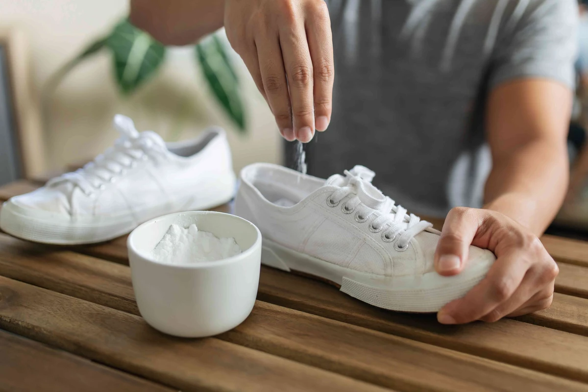 Baking soda sprinkled inside sneakers to remove shoe odor overnight