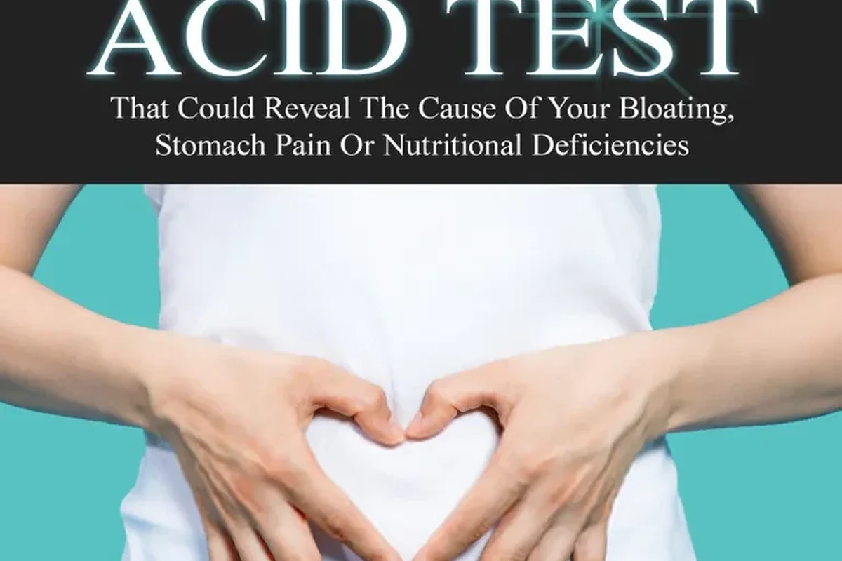 Glass of baking soda water beside a timer for a home stomach acid test