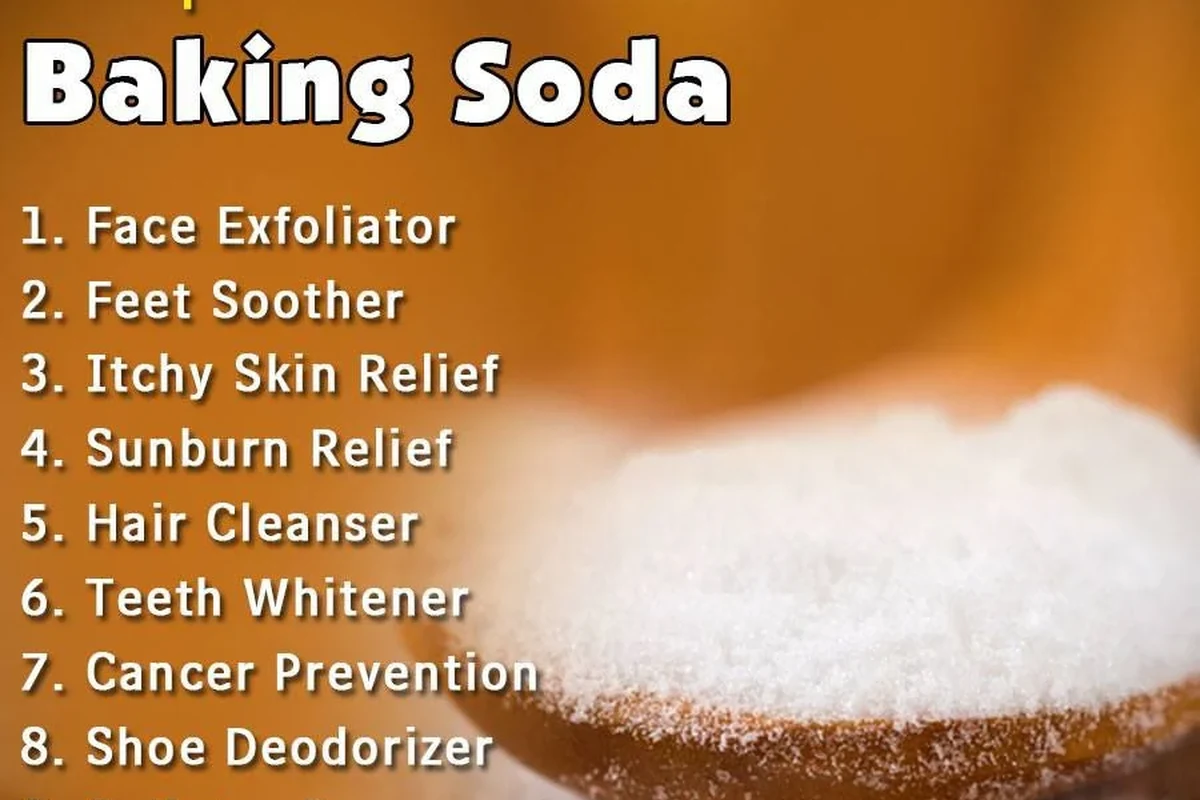 Bulk baking soda container beside measuring spoons in a bakery kitchen