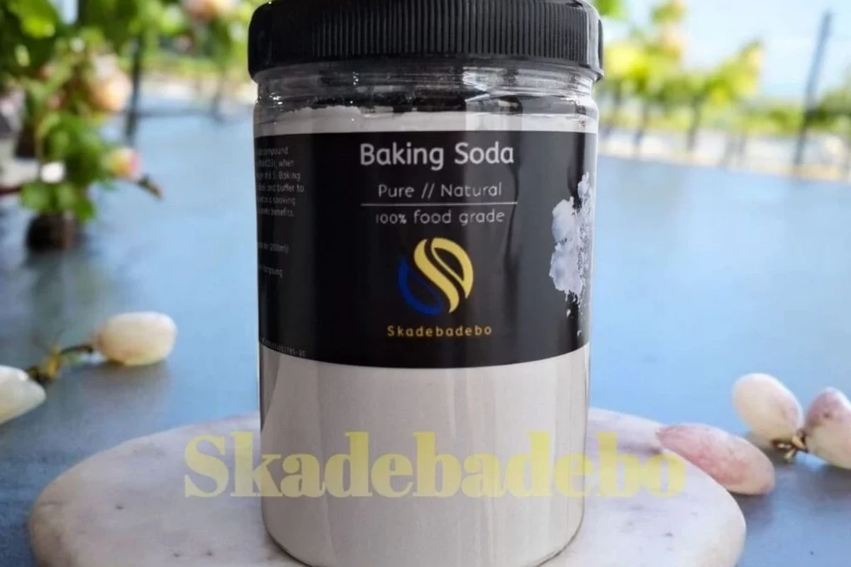 Food grade baking soda in a mixing bowl beside baking ingredients