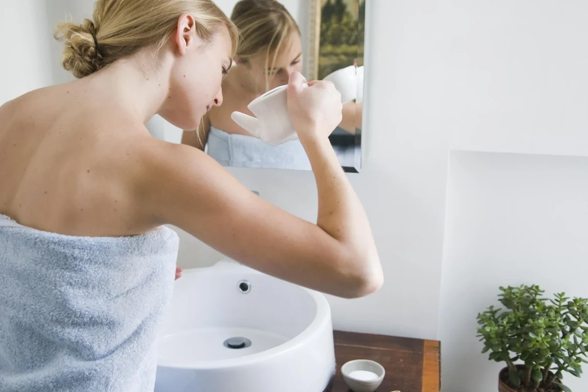 Buffered nasal rinse setup with salt, baking soda, clean water, and a rinse bottle